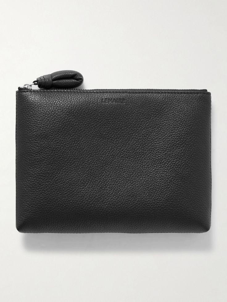 LEMAIRE's pouch is made from supple yet hard-wearing textured-leather that's padded to protect whatever you choose to carry within the canvas-lined interior. It's minimally detailed with a debossed logo and sized to fit a few cosmetics for touch-ups, along with your phone and keys. Black Leather Clutch For Everyday Use, Black Leather Pouch For On-the-go, Black Leather Pouch Clutch, Black Leather Clutch With Zipper Pouch, Classic Textured Leather Travel Pouch, Black Leather-lined Pouch Clutch, Black Leather Clutch With Leather Lining, Luxury Textured Leather Pouch For Daily Use, Classic Soft Leather Pouch For On-the-go