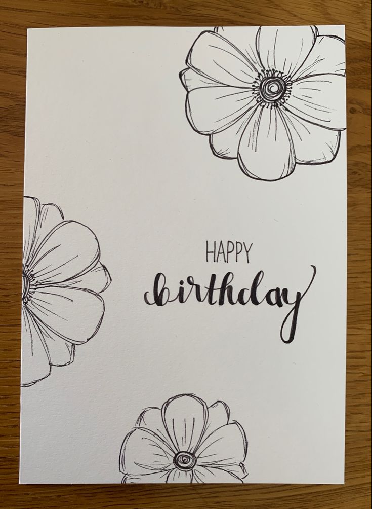 a handmade birthday card with flowers and the words happy birthday written in black ink