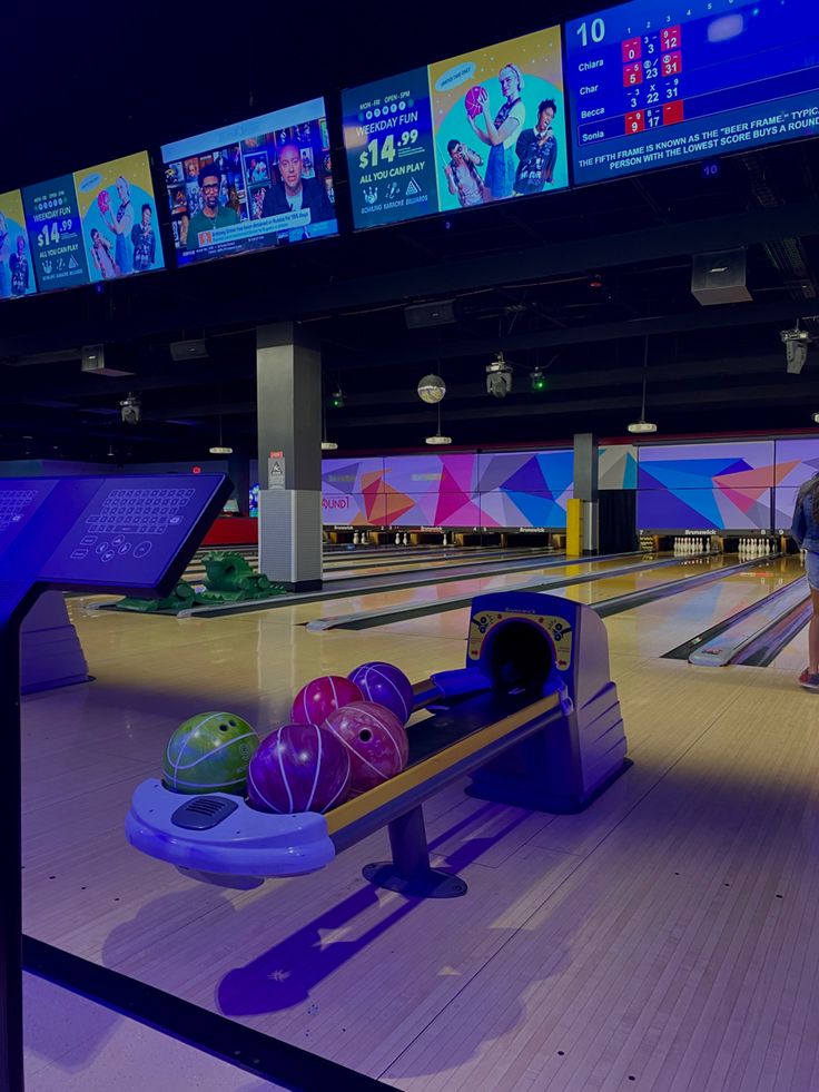 a bowling alley filled with lots of bowling balls