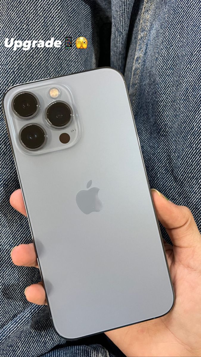 someone holding an iphone in their hand with the camera on it's left side