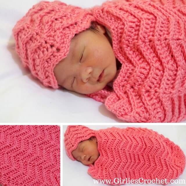 the baby is wearing a pink knitted hat and sleeping in it's crochet blanket