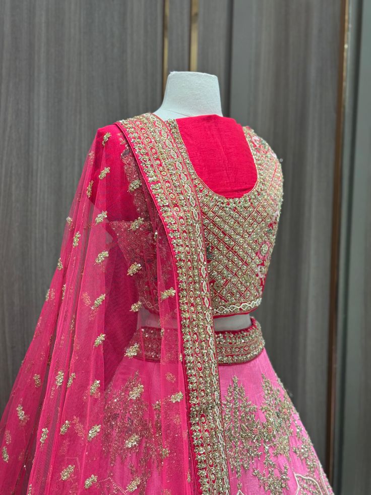 1. Pink ombre raw-silk lehenga features intricate details with multi-color resham, zardozi, sequins, and crystal embroidery. 2. Complete the ensemble with the included hot pink unstitched blouse and Net dupatta 3. Ready to ship ! Pink Raw Silk Set With Zari Work, Pink Raw Silk Saree For Reception, Pink Tissue Silk Set With Zari Work, Pink Chinon Sets With Zari Work, Reception Pink Raw Silk Saree, Party Wear Embroidered Lehenga In Raw Silk, Party Wear Raw Silk Choli With Intricate Embroidery, Party Wear Embroidered Tissue Silk Lehenga, Pink Art Silk Choli With Zari Work