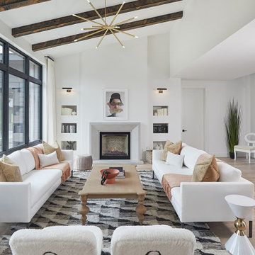 a living room filled with furniture and a fire place in the middle of a room