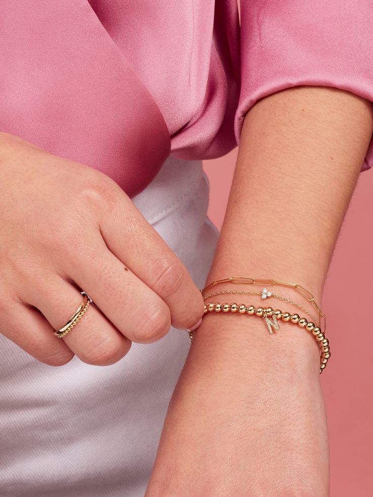 We can’t get enough of the paperclip trend! Our extra-small link style introduces a dainty new chain to your collection, and is part of our fine Paperclip Collection made of 14K gold. Mix and match with different sizes and pieces from the collection for especially on-trend stack. Modern Yellow Gold Charm Bracelet For Everyday, Stackable Gold Plated Chain Bracelet, Gold Minimalist Paperclip Bracelet, Gold Minimalist Paperclip Bracelet For Everyday Luxury, 14k Gold Filled Adjustable Paperclip Bracelet, Dainty 14k Gold Chain Bracelet, Dainty Gold Paperclip Bracelet, Dainty 14k Gold Filled Paperclip Bracelet For Everyday, Dainty 14k Gold-filled Paperclip Bracelet For Everyday