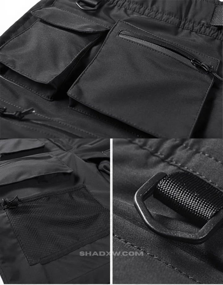 Design: Techwear, Ninja Techwear, Cyberpunk, Military, Futuristic Materials: Polyester Fit type: Regular Closure type: Elastic waist Suitable for men and women Machine washable: 30 °C (86 °F) FREE worldwide shipping Size(cm) Waist (cm) Hip Length S 72 103 48 M 82 107 49 L 86 111 51 XL 90 115 52 2XL 94 119 53 Black Functional shorts Keep a techwear style even in summer with these tactical shorts. Made from breathable materials, they are guaranteed to provide maximum comfort during the summer whil