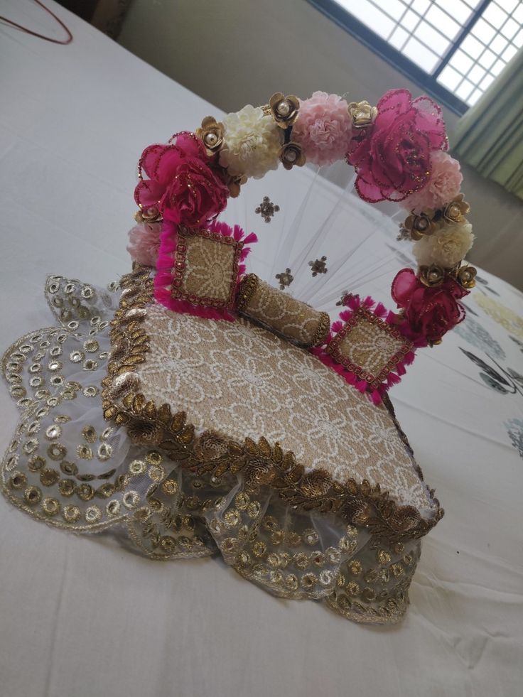 an elaborately decorated chair with pink flowers on it