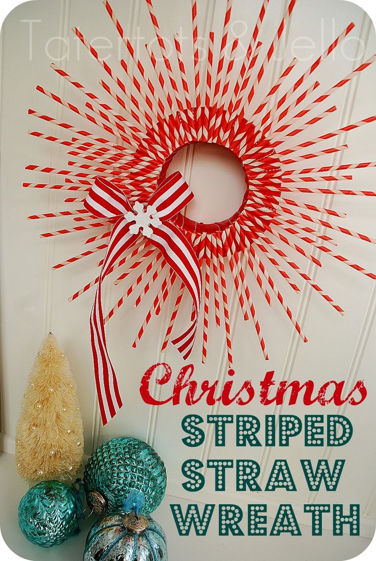 a red and white christmas decoration with the words, christmas striped straw wreath