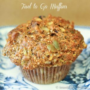 a muffin sitting on top of a blue and white plate