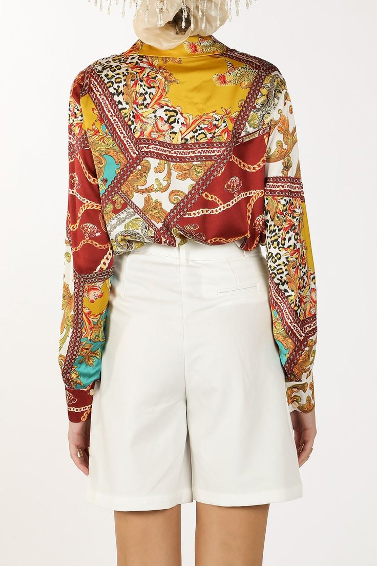 Experience the beauty and elegance of the Demi Baroque Style Printed Satin Blouse. This stylish top is adorned with intricate prints and made of luxurious satin fabric, making it a must-have addition to your wardrobe. Elevate any outfit with its unique and sophisticated design. Satin fabric Baroque chain style print Semi long collar Long sleeves Single button cuffs Gold metallic buttons Front button closure Regular fit Imported Model is 5'10" wearing a size Small 100%POLYESTER Caring for your cl Closet Vanity, Birthday Cocktails, Stylish Top, Travel Storage Bag, Wall Accessories, Baroque Style, Fabric Making, Travel Storage, Satin Blouse