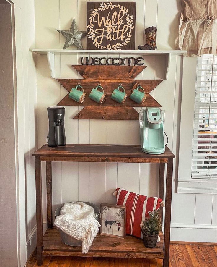 a wooden table sitting in the corner of a room next to a wall mounted sign