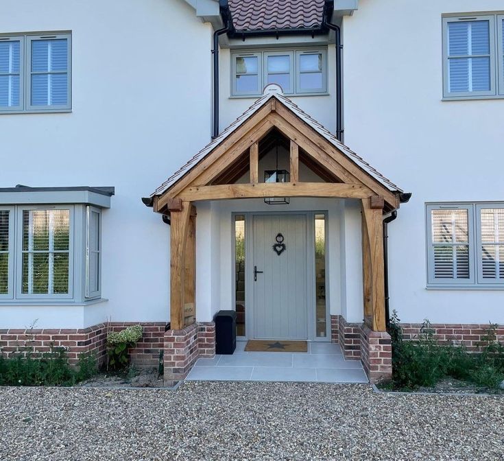 a white house with a wooden front door