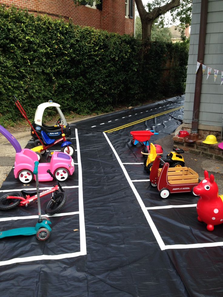 children's toys are lined up in the parking lot