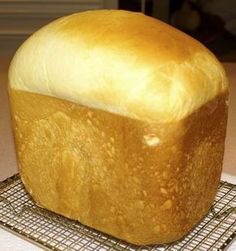 a loaf of bread sitting on top of a cooling rack