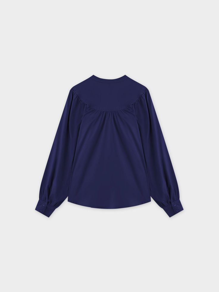 The Gathered Top Blouse-Navy is a versatile and stylish addition to any wardrobe. With its gathered design, it offers a sleek and flattering fit that can be dressed any occasion. Long Sleeve Navy Blouse For Fall, Navy Long Sleeve Blouse For Fall, Navy Long Sleeve Top For Work, Navy Elegant Long Sleeve Tops, Elegant Navy Long Sleeve Tops, Elegant Long Sleeve Navy Tops, Chic Navy V-neck Top, Chic Navy Top For Fall, Navy Stretch Tops For Work