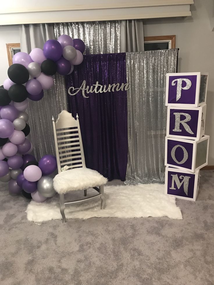 purple and silver balloon arch for prom or baby shower with white chair in the foreground