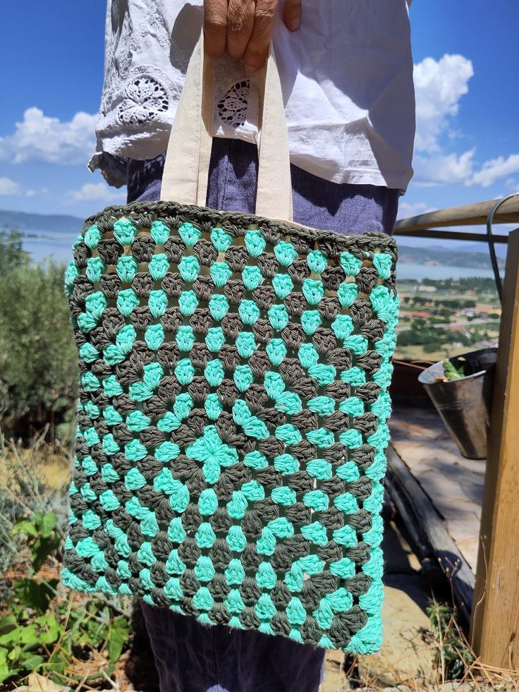 Crochet Granny Square Bag "Shades of Green" Lined with a sturdy canvas bag (100% cotton ÖkoTex) - hemmed by hand Size: 30 cm x 28 cm Hand-made in Italy Free shipping in Italy! Handmade Cotton Bag In Natural Color, Handmade Cotton Crochet Bag, Large Green Handmade Bag, Handmade Cotton Shoulder Bag, Large Green Handmade Bags, Large Handmade Green Bag, Large Handmade Green Bags, Bohemian Crochet Cotton Bag, Handmade Cotton Shoulder Bag For Market