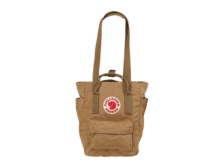 Fjallraven Kanken Totepack Mini - Tote Handbags : Clay : The Fjällräven Kånken Totepack Mini is a smaller commute option to take anywhere, transforming from a tote, to a backpack with ease when changing commute options or walking around the local grocer. Waterproof G-1000 HeavyDuty Eco S fabrication keeps your stuff dry all-day long. Main compartment can hold all your daily essentials. Interior lined with a padded base for tablets. Zippered top main compartment opening. Front zippered compartmen Casual Backpack With Top Carry Handle, Casual Daily Use Backpack With Top Carry Handle, Casual Outdoor Bags With Adjustable Straps, Casual Waterproof Beige Bags, Casual Waterproof Backpack For Everyday Use, Kanken Totepack Mini, Fjallraven Kanken Totepack, Kanken Totepack, Fjallraven Totepack