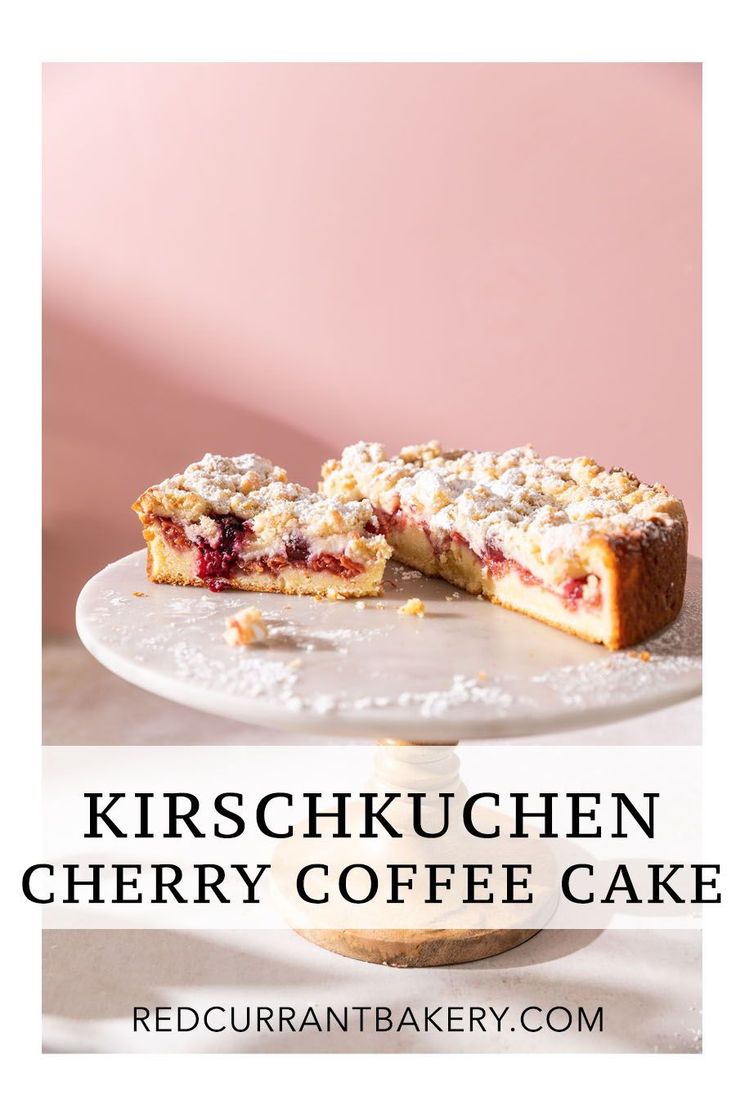 a cherry coffee cake on a plate with the words kirschkuchen cherry coffee cake