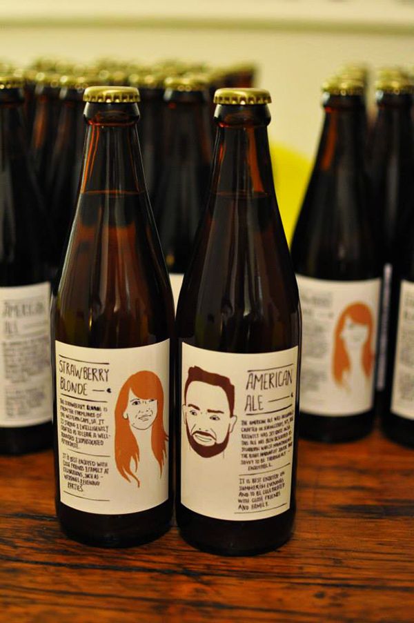 several bottles of beer sitting on top of a wooden table