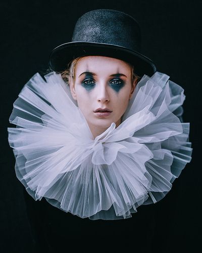 black and white photograph of a woman wearing a hat