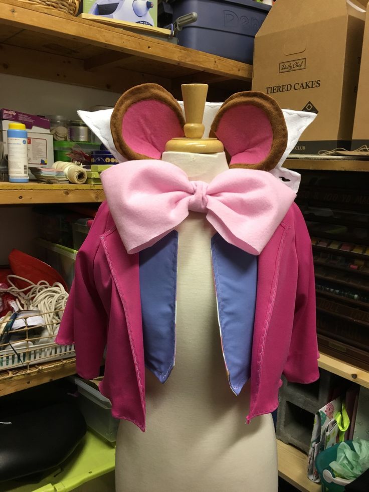 a dress made to look like minnie mouse ears with pink and blue bows on it