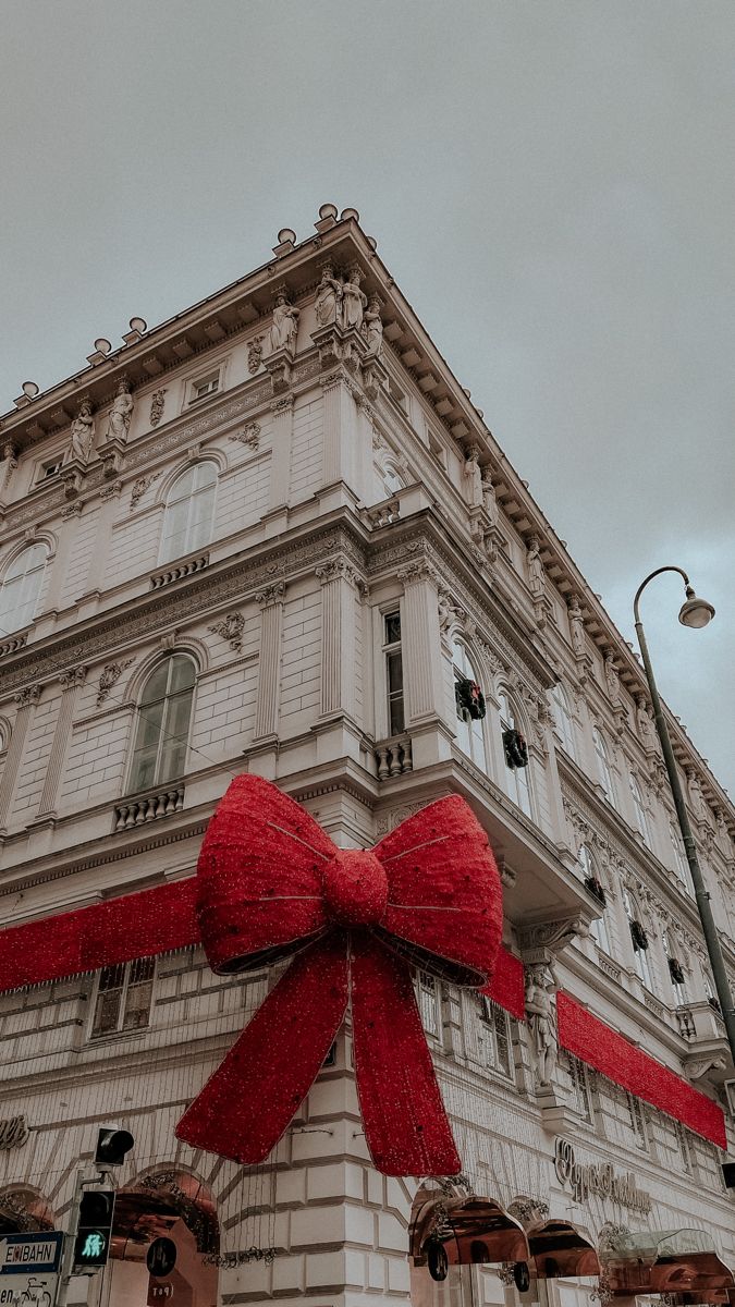 a large red bow on the side of a building