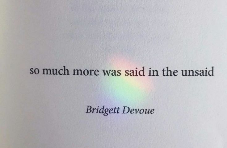 a book with an image of a rainbow in the middle and some words on it