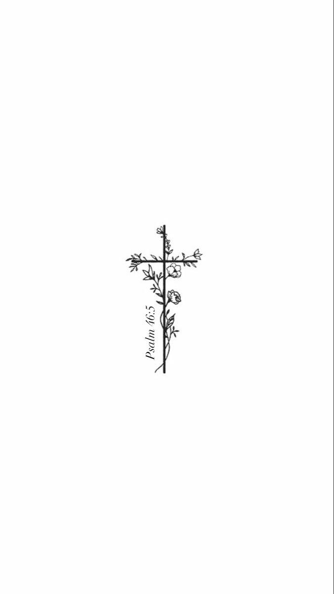 a black and white photo of a cross with flowers on the side, against a plain background