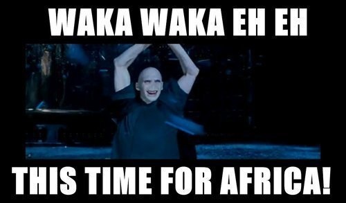 a man holding his hands up in the air with text reading waka waka ehh this time for africa