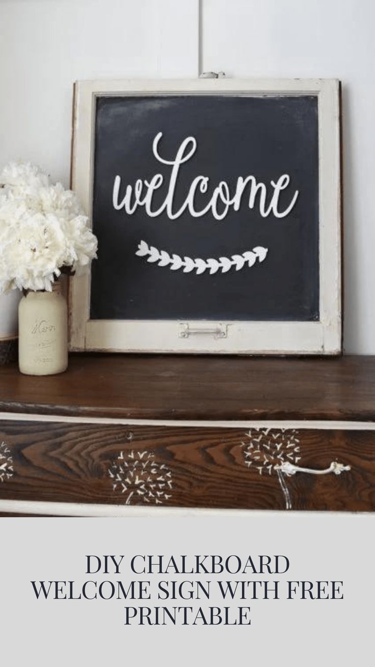 a chalkboard welcome sign with free printables is displayed on an old dresser