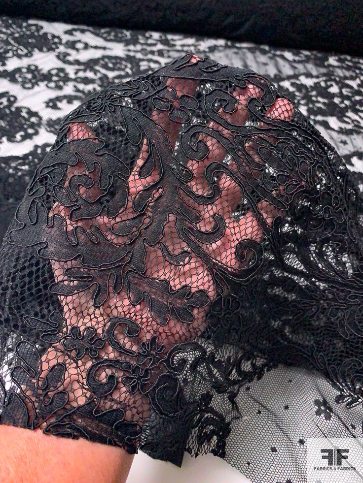 This black Victorian design corded lace designer fashion fabric will take you back to the era of corsets, bonnets, top hats, bustles and petticoats. SKU: 12368 Content: Polyester Color: Black Width: 57 inches Vintage Lace Fitted For Party, Vintage Fitted Lace For Parties, Vintage Style Fitted Lace For Party, Fitted Lace Patchwork For Party, Party Black Lace With Contrast Detail, Fitted Victorian Lace With Lace Trim, Stretch Lace With Lace Patchwork For Party, Black Lace With Lace Trim For Party, Black Lace With Lace Closure For Evening