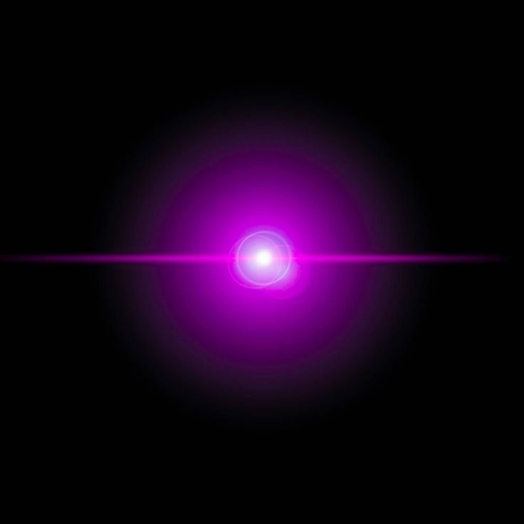 a bright purple light shines brightly in the dark