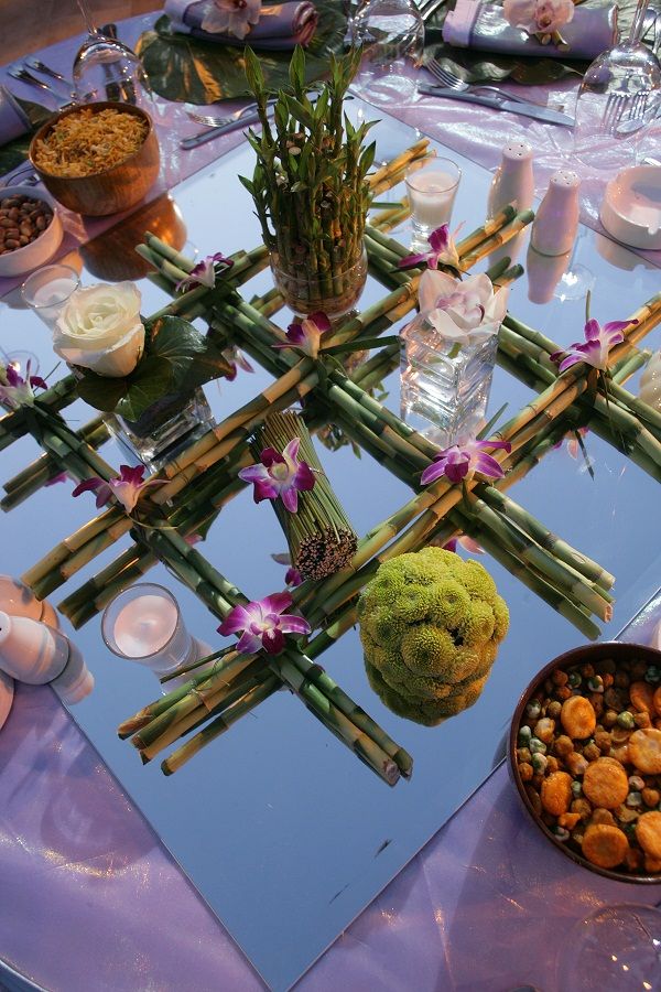 a table topped with lots of food and flowers