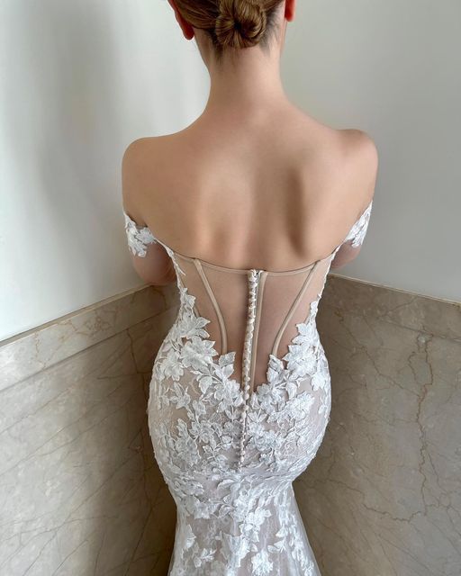 the back of a woman's wedding dress