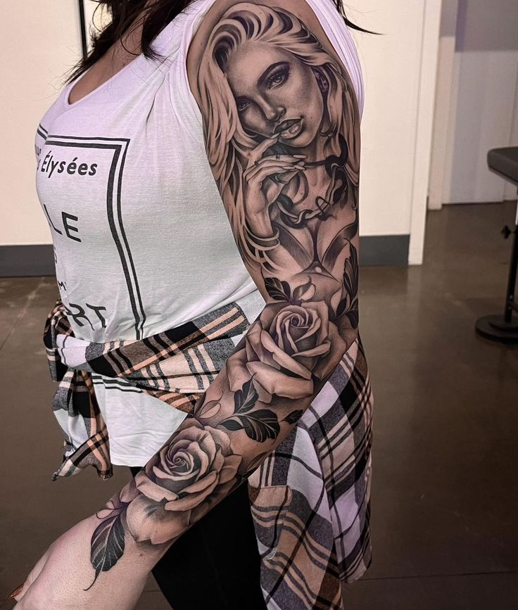 a woman with a tattoo on her arm