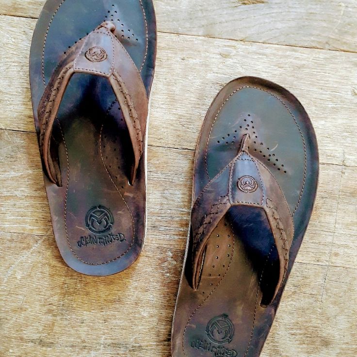 We Just Bought All The Inventory From Ocean Minded Inc..They Are Shutting Down And Leaving California For Good..We Have 9,000 Pairs...Bulk Discounts Available..Please Contact Us On Pricing For 50 Or More Pairs...Msrp $85 Brown Flip Flops With Ortholite Insole, Leather Round Toe Flip Flops For Beach, Brown Synthetic Toe Post Flip Flops, Brown Synthetic Sandals With Cushioned Footbed, Brown Synthetic Flip Flops With Textured Footbed, Casual Brown Flip Flops With Ortholite Insole, Leather Flip Flops With Round Toe For Vacation, Leather Flip Flops For Vacation, Casual Brown Sandals With Ortholite Insole