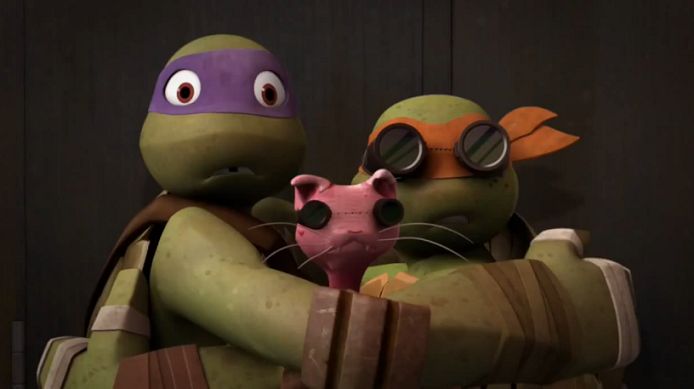 the teenage mutant turtles are hugging each other