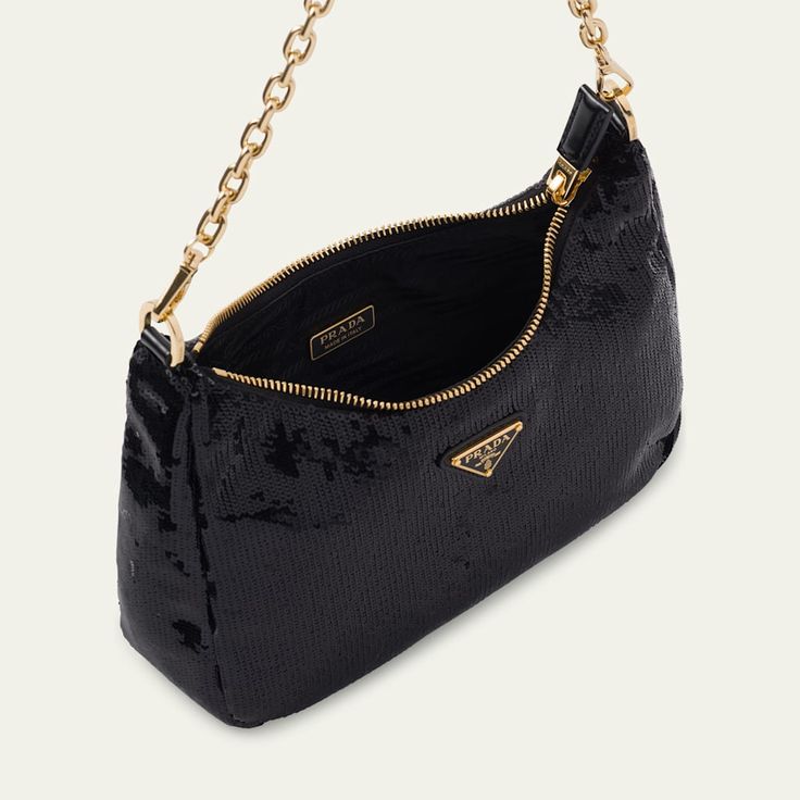 Prada pouch shoulder bag in sequin nylon and leather  Signature triangle logo accent  Detachable chain top handle  Detachable flat leather shoulder strap  Can be worn as a top handle or shoulder bag  Zip top closure  Approx. 7"H x 8.6"W x 2.4"D Made in Italy Luxury Crossbody Baguette Bag With Zipper, Evening Baguette Bag Pouch With Zipper Closure, Evening Top Handle Baguette Bag With Chain Strap, Evening Top Handle Baguette Bag With Zipper, Evening Baguette Bag With Zipper Closure And Top Handle, Evening Baguette Bag With Top Handle And Zipper, Evening Baguette Bag With Chain Strap And Top Handle, Luxury Evening Baguette Bag With Detachable Strap, Luxury Evening Baguette Bag With Adjustable Strap