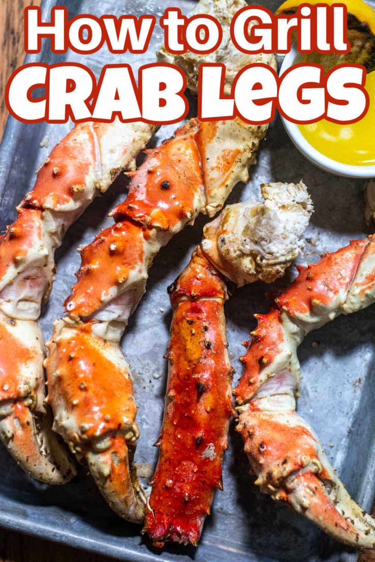 how to grill crab legs on a tray with dipping sauce in the background and text overlay that reads, how to grill crab legs