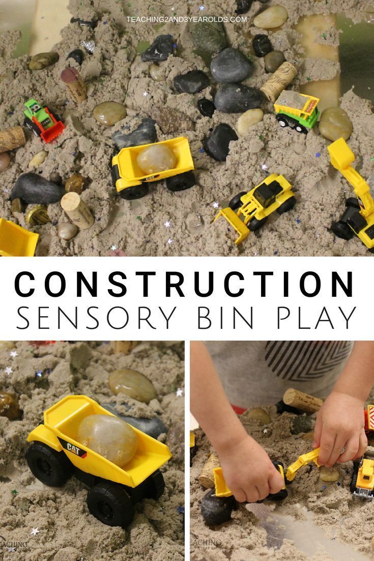 a boy playing with construction toys in the sand