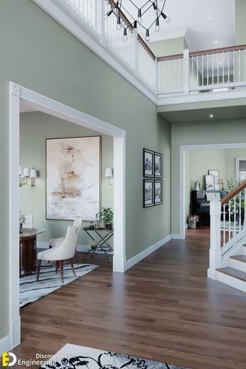 a large open floor plan with stairs leading up to the second story