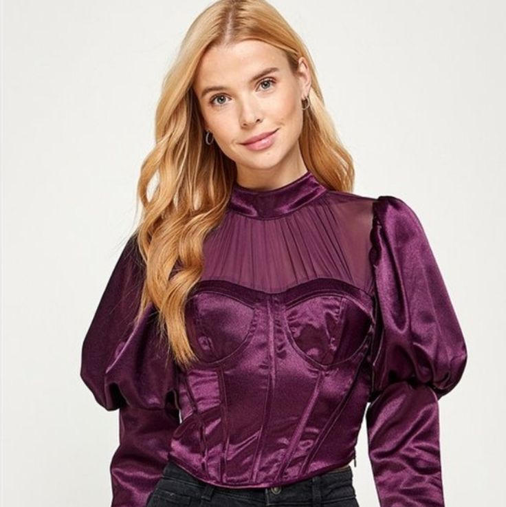 Long Sleeves Corset Top With Contrast Mesh. 100% Polyester Measurements: S- Bust 34", Waist 27" M- Bust 36", Waist 29" L- Bust 38", Waist 31" Fitted Purple Blouse For Party, Purple Puff Sleeve Top For Party, Purple Puff Sleeve Party Top, Fitted Purple Padded Blouse, Fitted Purple Chic Blouse, Chic Fitted Purple Blouse, Elegant Purple Tops For Date Night, Elegant Purple Top For Date Night, Long Sleeve Corset Top