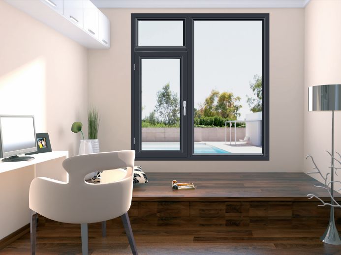 an empty room with a desk, chair and large glass door leading to a swimming pool