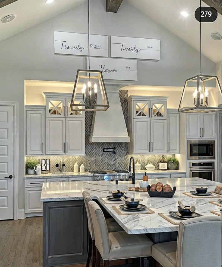 a large kitchen with an island in the middle and lots of counter space on each side