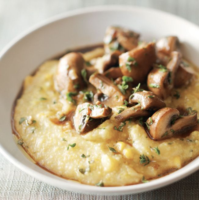 a white bowl filled with mashed potatoes and mushrooms