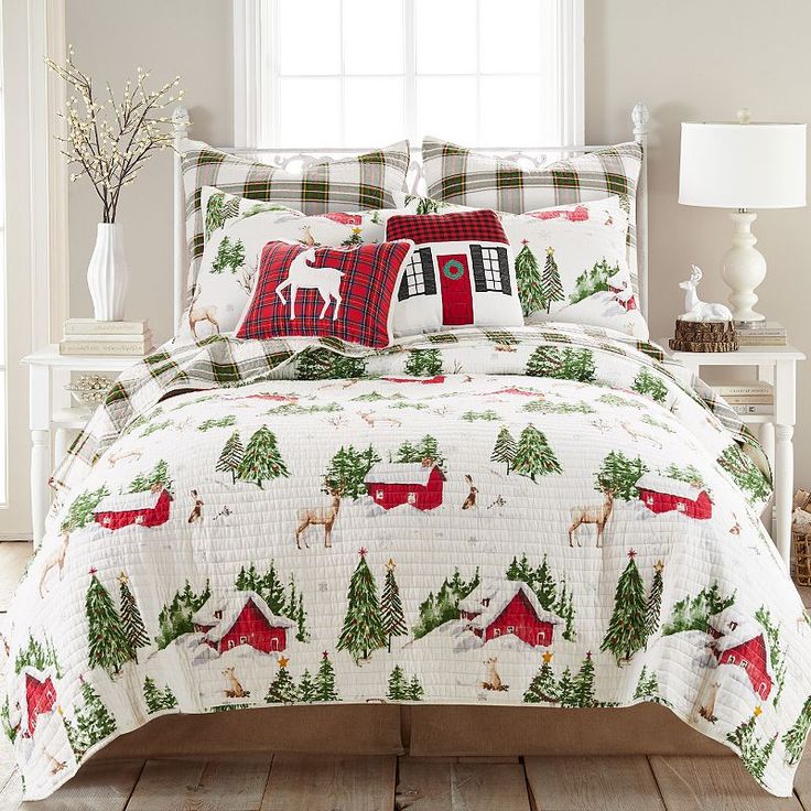 a christmas themed bed set with deer and trees