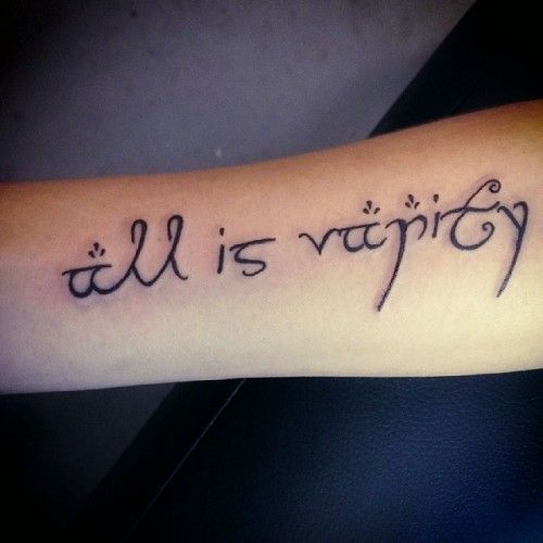 a tattoo with the words all is vanity written in cursive writing on it