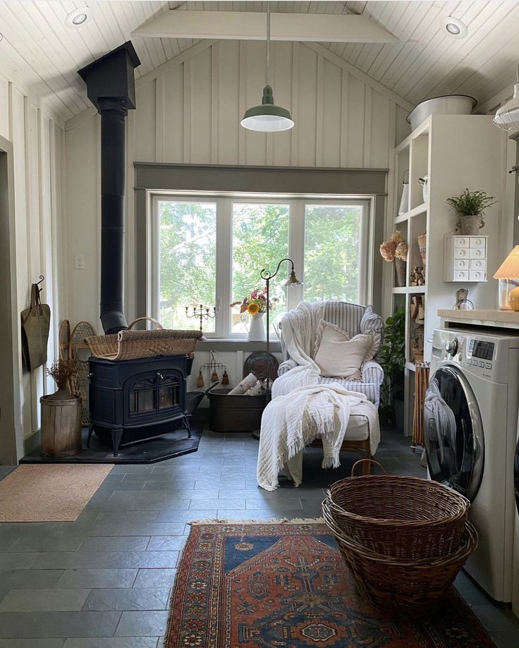 a living room filled with furniture and a fire place next to a stove top oven