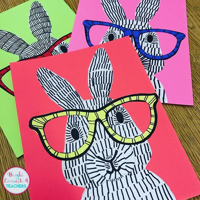 three different colored paper cards with glasses on them, one has an image of a rabbit wearing