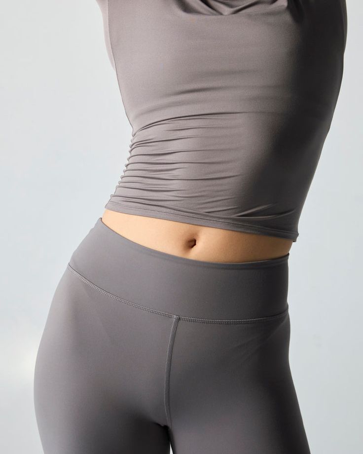 The silky smooth, breathable, and effortlessly sexy layer your warmup has been craving. Searching for a practical styling piece that instantly elevates any active outfit? Look no further. Wear the performance slip with a sports bra and leggings, or over a onesie to achieve that “dancer-core” aesthetic. High Stretch Bottoms With Built-in Bra For Workout, Versatile Solid Activewear With Minimal Stretch, Sleeveless Stretchy Athleisure Activewear, Sleeveless Micro-elastic Athleisure Activewear, Sleeveless Athleisure Activewear, Gray Compression Activewear With Built-in Bra, Compressive Seamless Gray Activewear, Compressive Gray Seamless Activewear, Compression Yoga Pants With Built-in Bra For Pilates